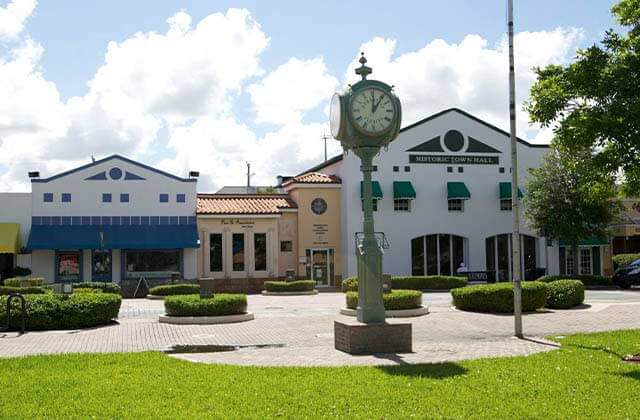 town square with historic storefronts and clock at tropical everglades visitor center homestead