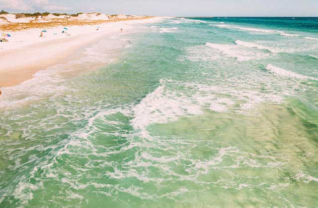 beach with dunes sand bar and transparent surf at panhandle beaches