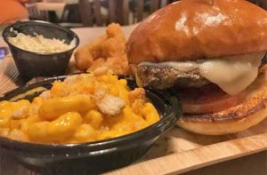 burger with mac n cheese and sides at boggy bottom barbecue kissimmee