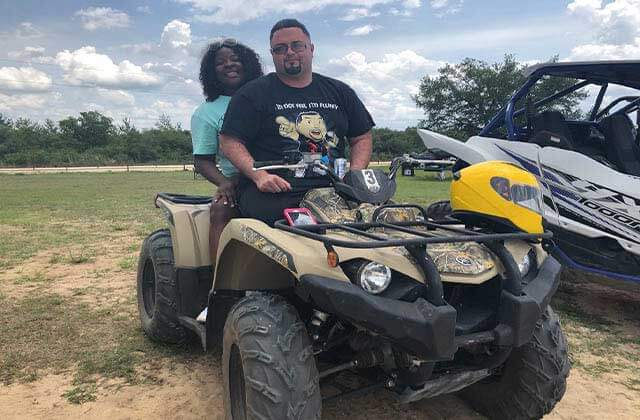 couple on atv smile at world adventures ocala