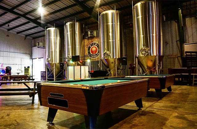 pool tables beer silos and vats at inside miami brewing company