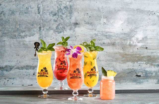 row of colorful tropical drinks at hard rock cafe miami