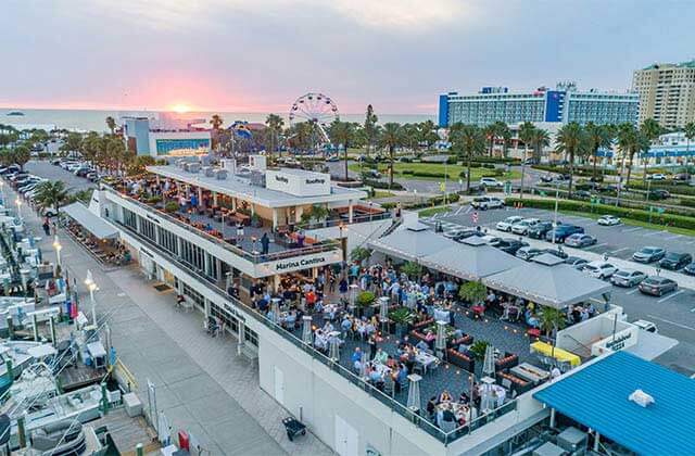 aerial view of marina restaurant at sunset with hotels and ferris wheel at marina cantina tequila bar grill clearwater