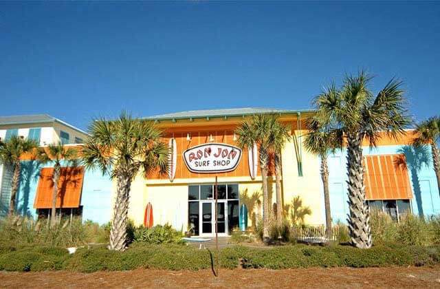 colorful cabana style exterior storefront with palm trees at ron jon surf shop panama city