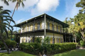 exterior yellow white spanish colonial style house at the hemingway home museum key west