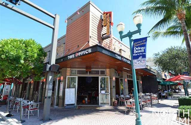 front exterior of street corner restaurant at the office prime burgers craft beer delray beach