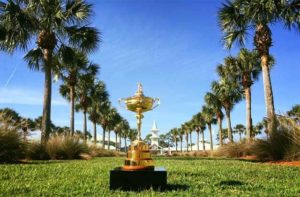 golf trophy with line of palm trees and club house on green at pga golf club port st lucie