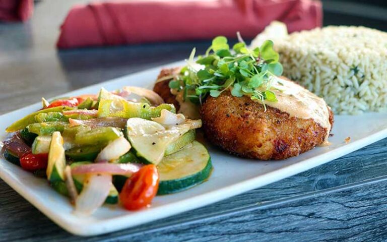 grouper cakes with vegetables and rice entree at salt cracker fish camp clearwater beach