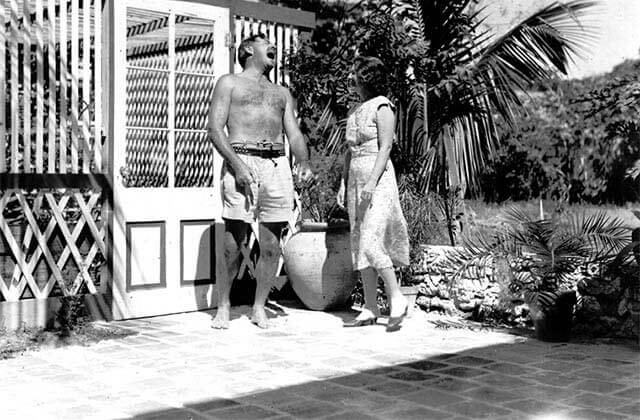 historic black and white photo of ernest hemingway and wife in the pool area at the hemingway home museum key west