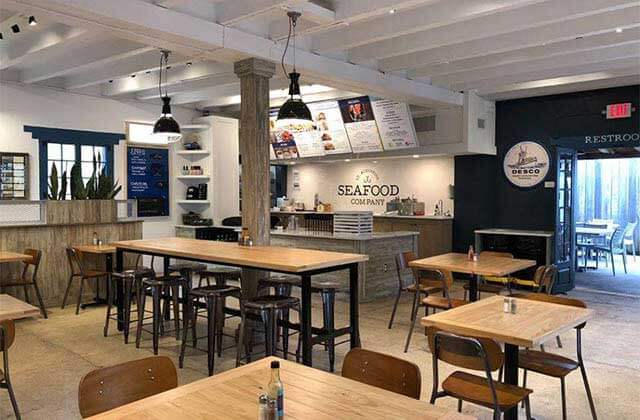 interior dining area with natural wood and nautical decor at st augustine seafood company