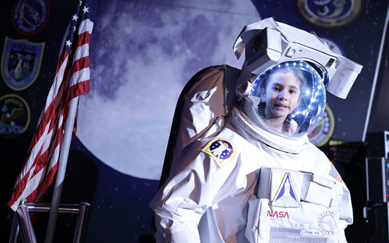 little girl face in astronaut suit photo op at wonderworks panama city beach