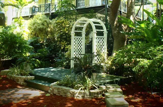 lush tropical garden with arbor at the hemingway home museum key west