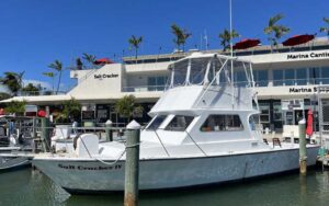 marina with boat and restaurant exterior at salt cracker fish camp clearwater beach