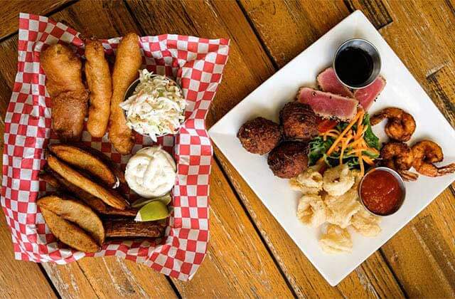 platters of fried seafood with sides at viva argentinean steakhouse key west