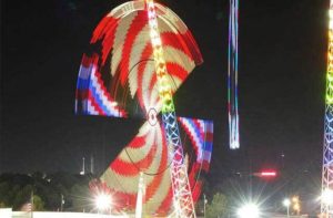 red white and blue light swirls at night attractions at slingshot vomatron panama city beach