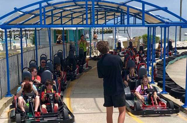 rows of go karters ready to race on a track at lagunas beach bar grill pensacola