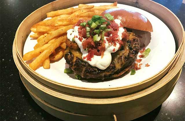 signature burger entree with fries at fish lips cocoa beach