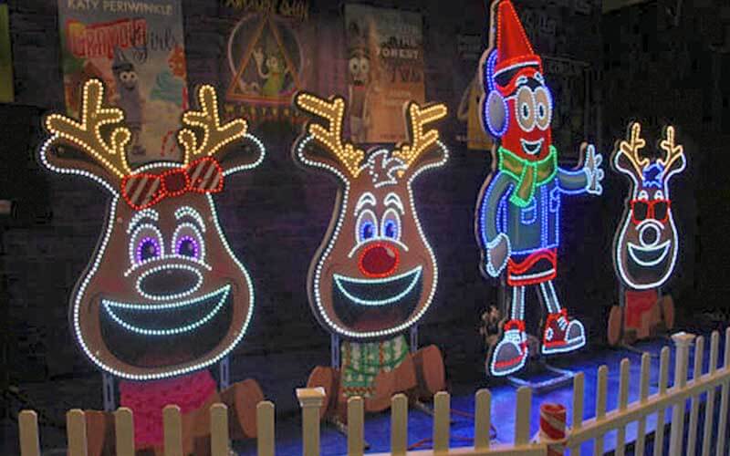 light displays of reindeer and a crayola crayon cartoon