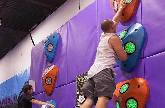 man and woman compete in jump button game at altitude trampoline park kissimmee