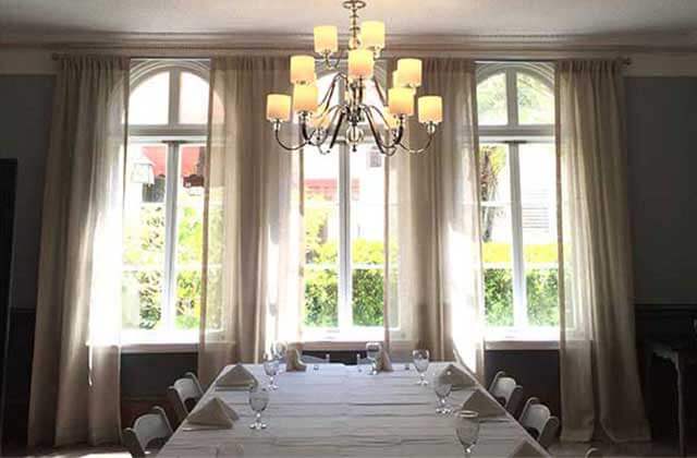 upscale dining room with vaulted windows and chandelier at the lodge at wakulla springs state park florida