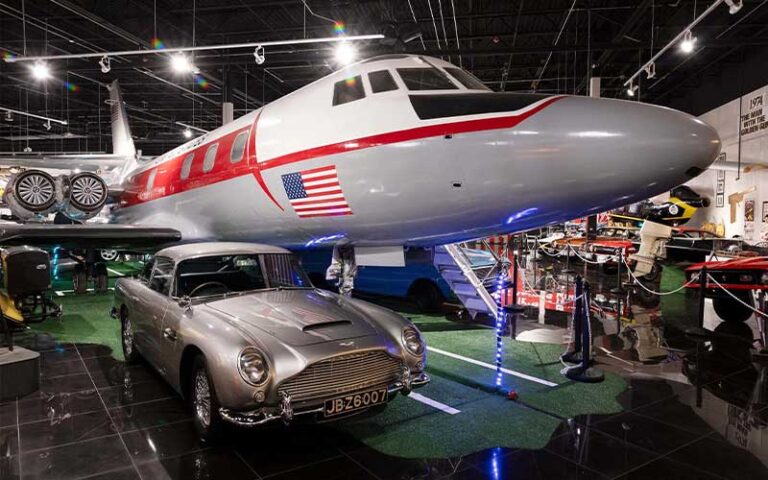 james bond exhibit with airplane and silver car at orlando auto museum at dezerland park
