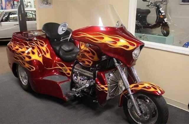 large red custom motorcycle with yellow flames design at orlando auto museum dezerland