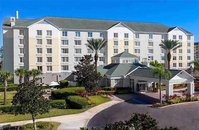 aerial of front exterior of hotel with trees at hilton garden inn orlando international drive north