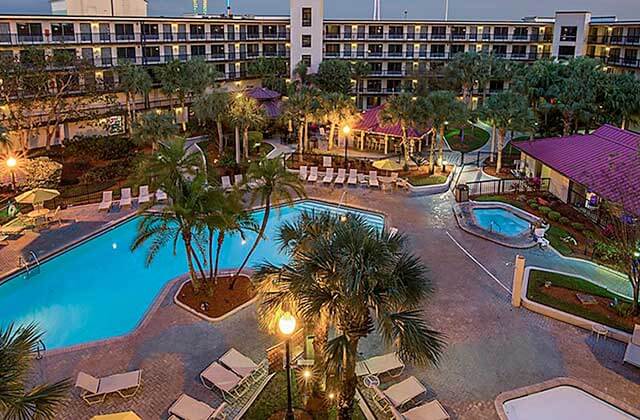 aerial view of pool area at night with jacuzzi at staybridge suites orlando royale parc suites