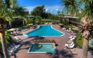 aerial view of pool with landscaping and hot tub at rosen international