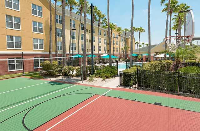 basketball and volleyball court near pool at homewood suites by hilton orlando ucf area