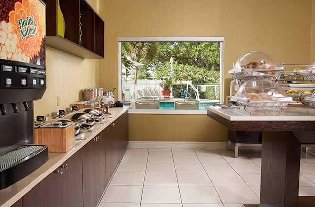 breakfast buffet area with kitchen at springhill suites fort lauderdale airport and cruise port