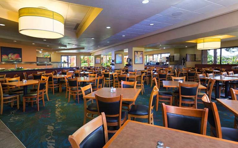 dining area with breakfast buffet tables and chairs at rosen inn lake buena vista