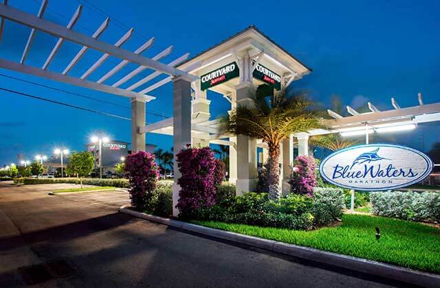 front entrance to hotel with pergola at night at courtyard marathon florida keys