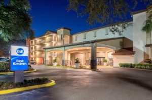 front exterior at night of hotel building with drop-off entrance at best western international drive orlando