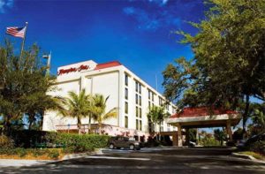 front exterior of hotel with trees and parking at hampton inn ellenton bradenton florida