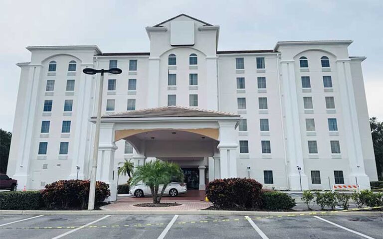 front exterior of white high rise i drive hotel at universal orlando