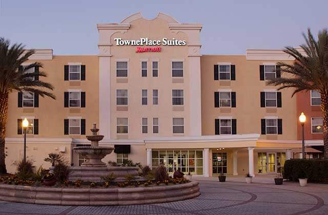 front exterior with fountain and drop-off at towneplace suites the villages