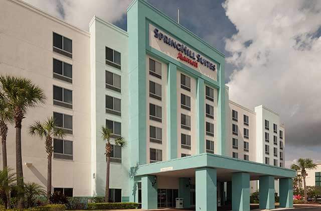 front exterior with teal of hotel building at springhill suites orlando airport