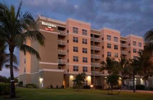 high rise hotel exterior at twilight at residence inn fort myers sanibel