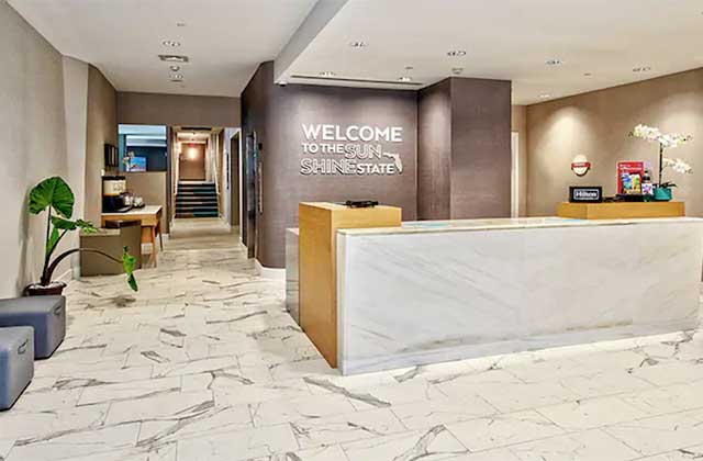 lobby with front desk and marble floors at hampton inn miami beach mid beach