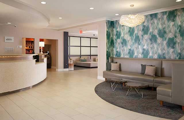 lobby with trendy seating and chandelier at residence inn fort myers sanibel