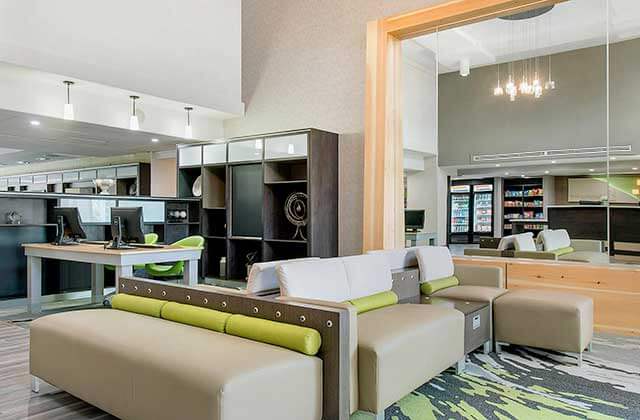 lounge area with sofas lobby business center and snack machines at holiday inn melbourne viera conference center