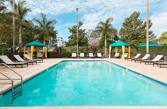 pool area with teal and orange cabanas at hampton inn ellenton bradenton florida