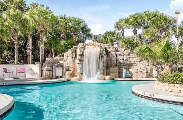 resort style pool area with waterfall slide at crowne plaza orlando lake buena vista