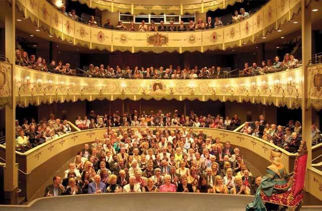 view from stage of odeon style theater with three balcony tiers and gold accents at the ringling museum of art sarasota