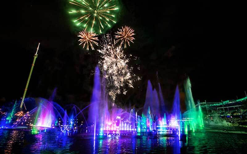 beautiful fireworks display with illuminated colored water displays dance to music at Seaworld orlando's electric ocean and fireworks display 