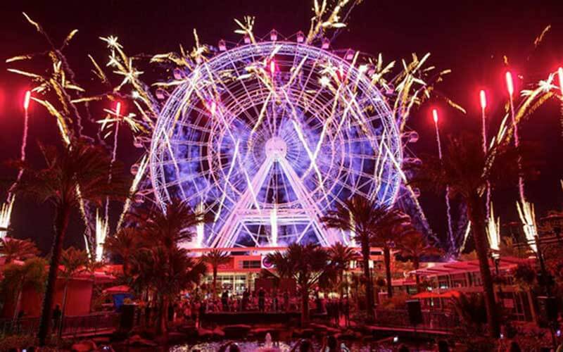 fireworks display in front of the observation wheel at icon park orlando florida