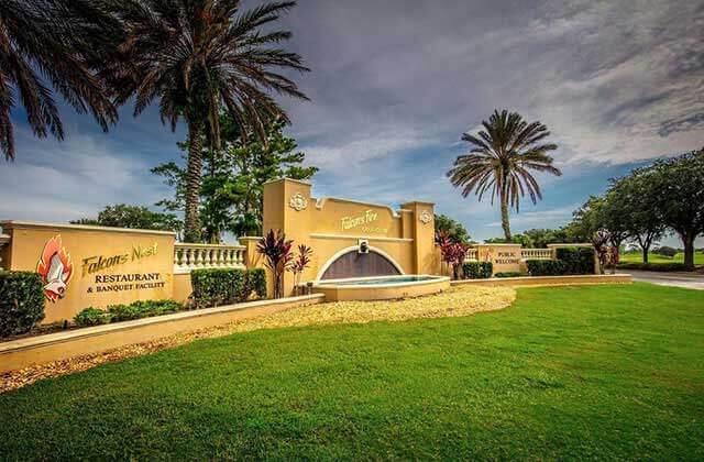 exterior front entrance next to road with palm trees at falcons fire golf club kissimmee