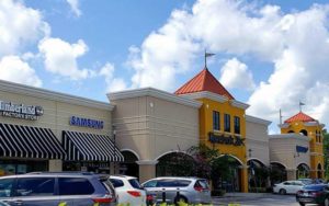 exterior storefronts of reebok timberland and samsung outlets at lake buena vista factory stores