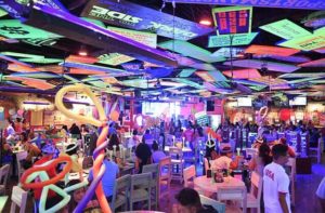 interior dining area with day glow signs on ceiling and party balloons at senor frogs orlando